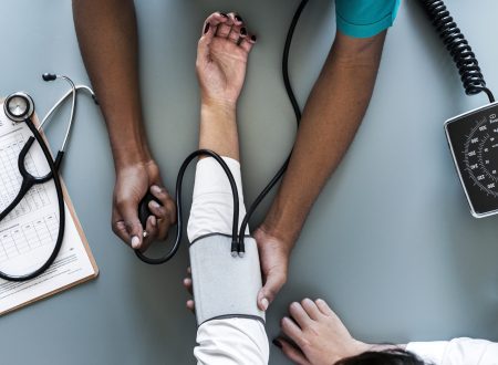 Nurse measuring patient blood pressure